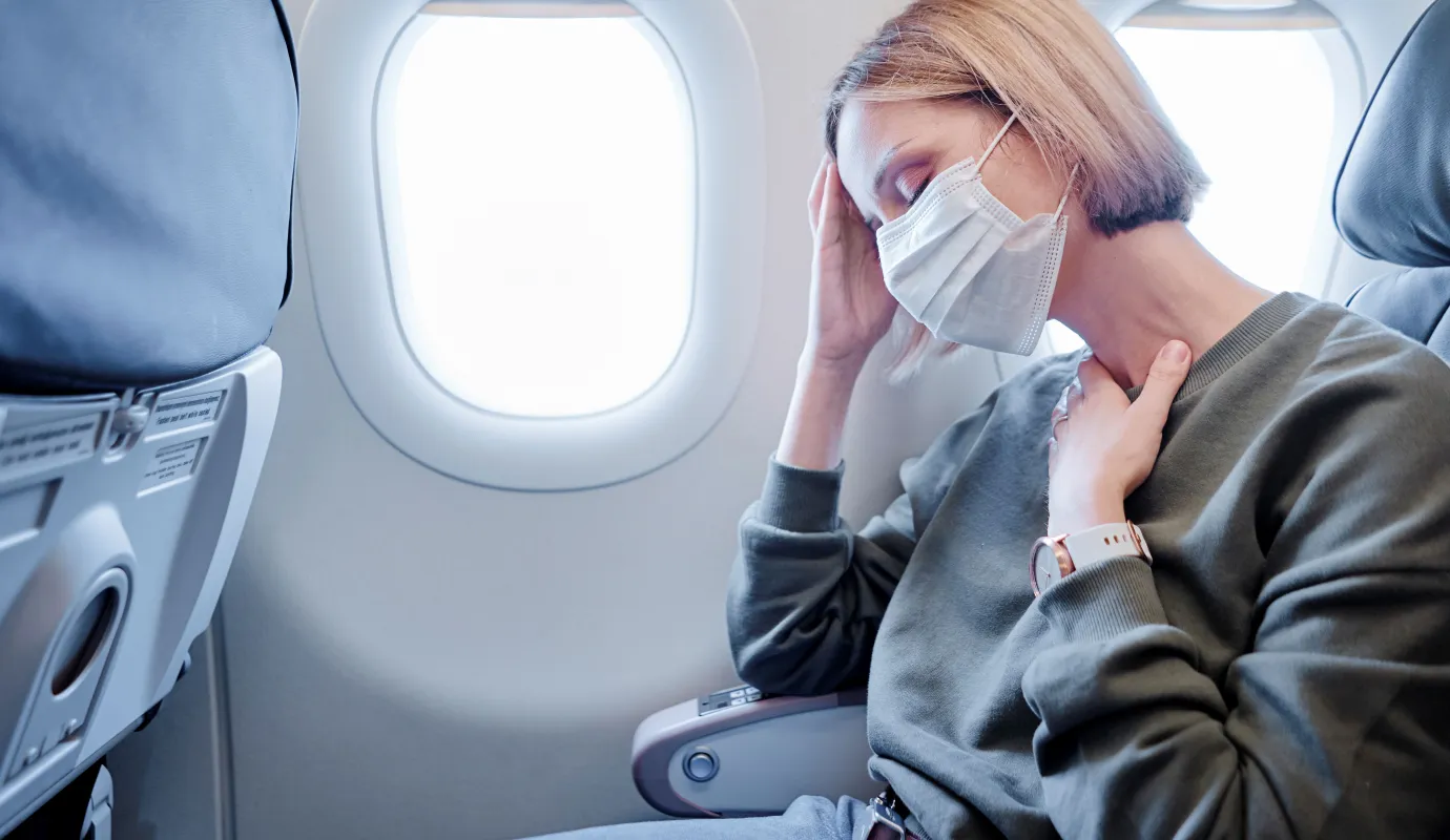 Adobe, Krank im Flugzeug