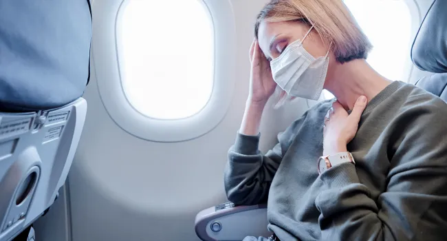 Adobe, Krank im Flugzeug
